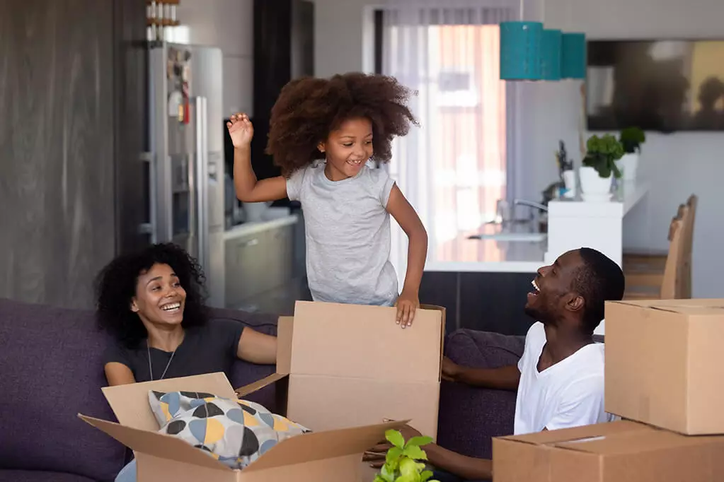 Happy mixed race child jumping